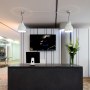 Advertising Agency redesign | Concrete reception desk | Interior Designers